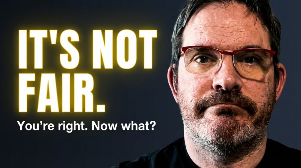 Close on Etienne face not smilingon black background. "It's Not Fair" in Big glowing letters, with smaller header saying "You're right. Now what?" under it.